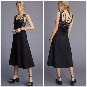 Black modern pinafore dress by anthropologie